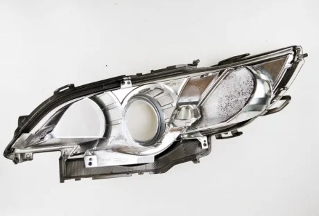 Стекло фары передней SUBARU 84990AG560