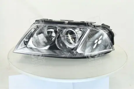 Фара лів. VW PASSAT B5 00-05 TYC 206244052B